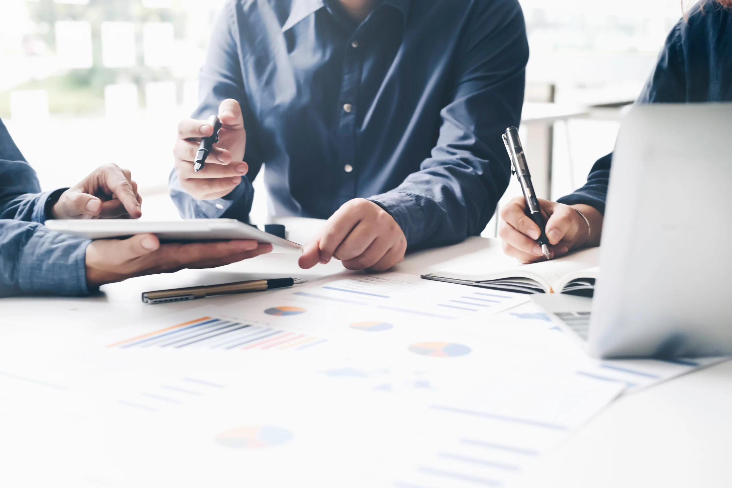 Asian business adviser meeting to analyze and discuss the situat Asian business adviser meeting to analyze and discuss the situation on the financial report in the meeting room.Investment Consultant,Financial Consultant,Financial advisor and accounting concept
